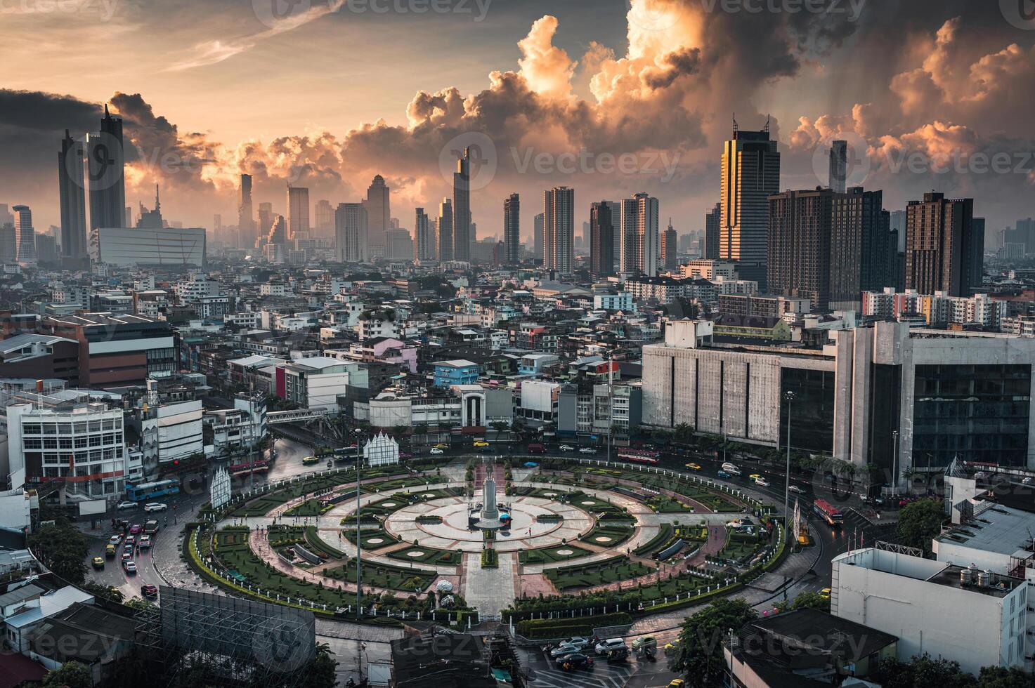 Wongwianyai roundabout monument with crowded residence and skyscraper in the morning at Bangkok photo