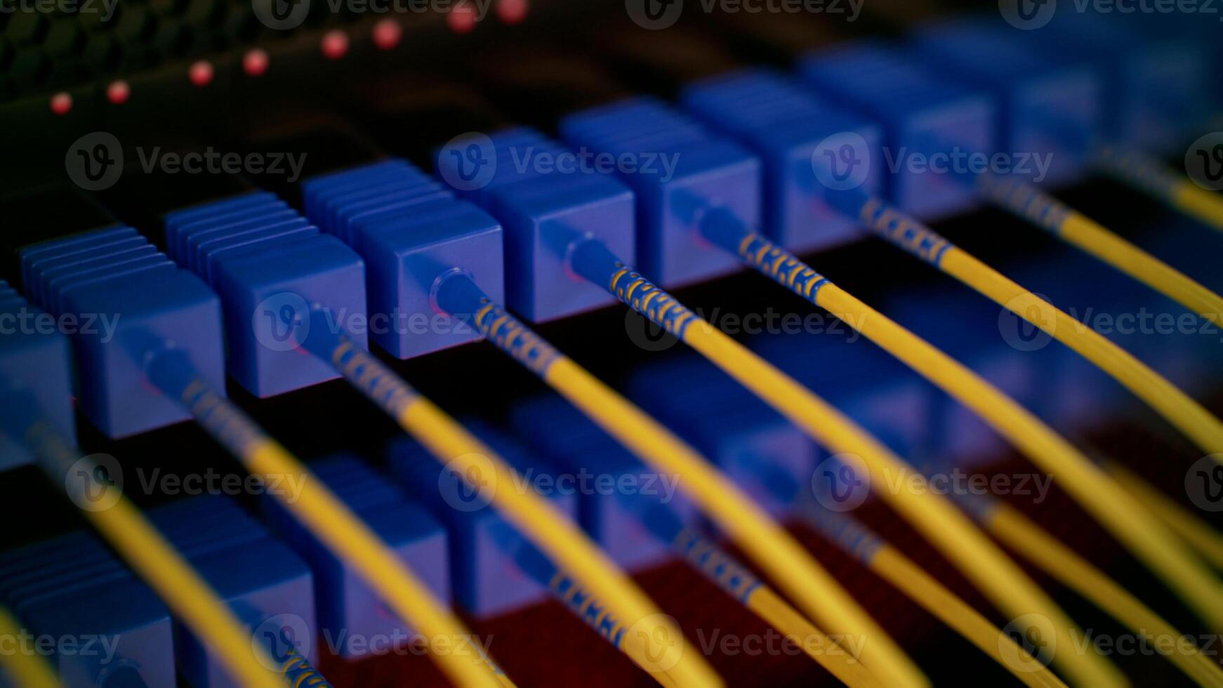 Fiber Optical internet and network cable connected in modern switch. Concept of modern Internet connection. Selective focus, close up, soft and blurred background. photo