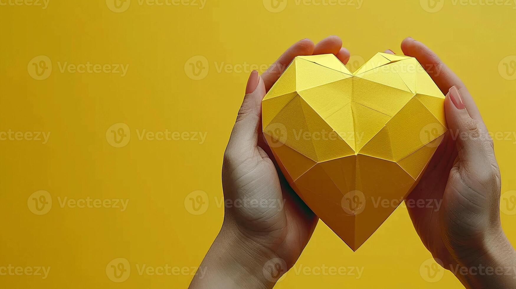 Hands delicately holding yellow low poly heart image copy space. Handmade creation, polygonal shape banner background. Love, creativity and unity concept photography copyspace photo