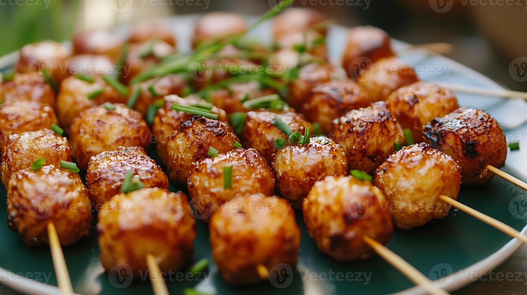 A plate of food with skewers on it photo