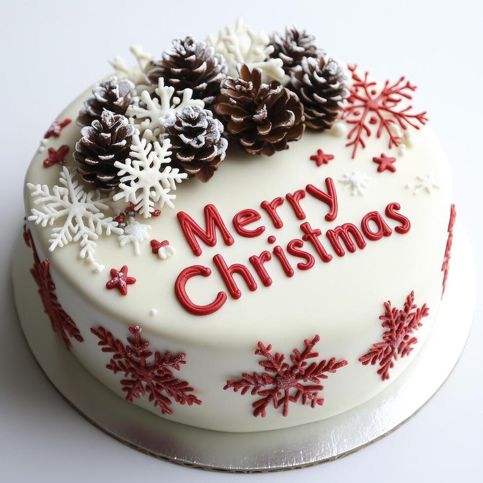 White background, red and white lettering Merry Christmas in the middle of a festive cake decorated with snowflakes and pine cones photo