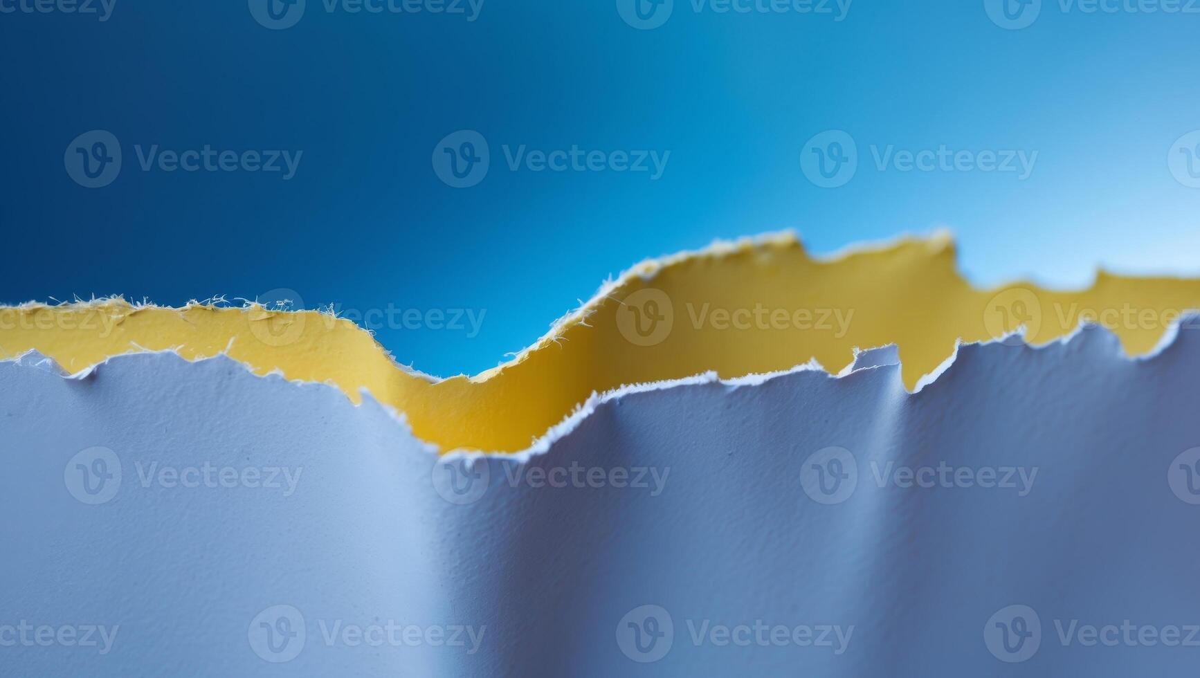 A torn piece of paper with a yellow piece missing photo