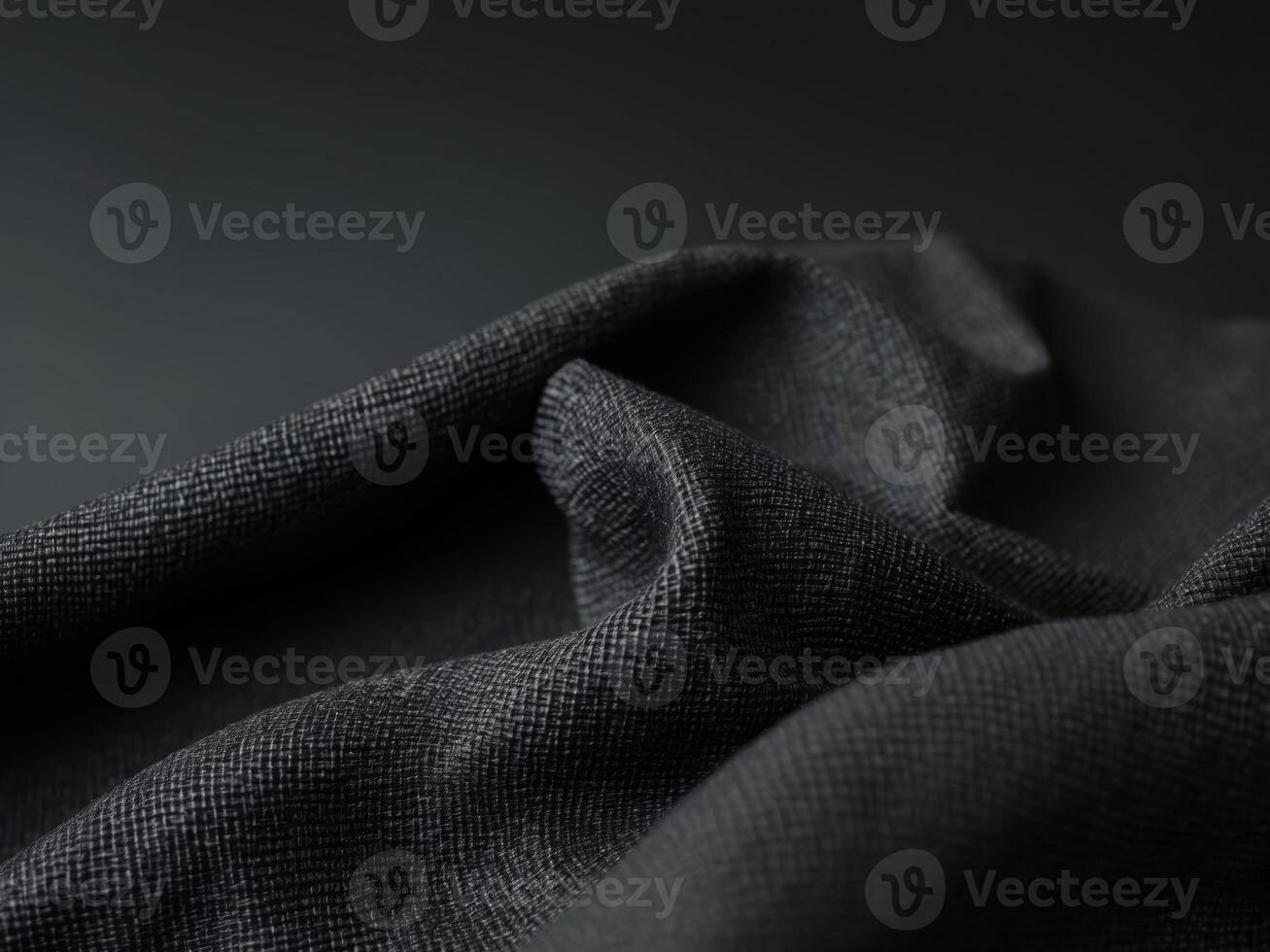 Textured black fabric background showcasing coarse woven structure ideal for design and textile applications. photo