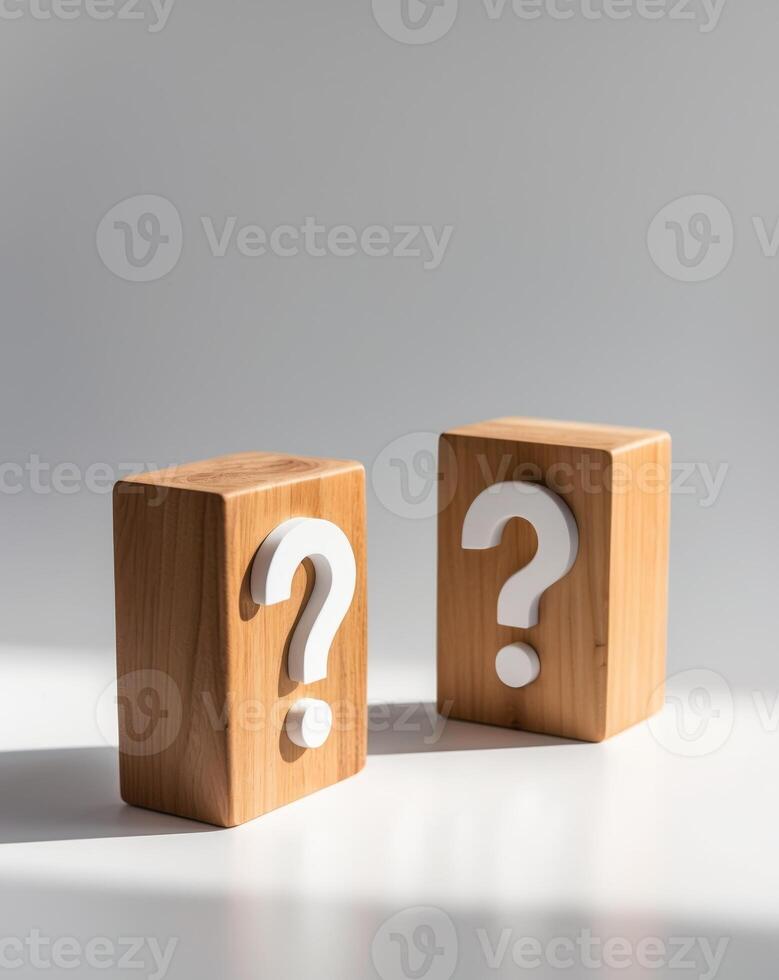Two wooden blocks with a question mark on each photo