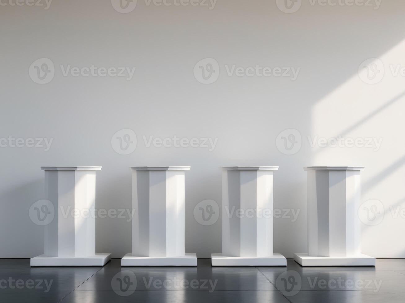 Three white pedestals in front of a white wall photo