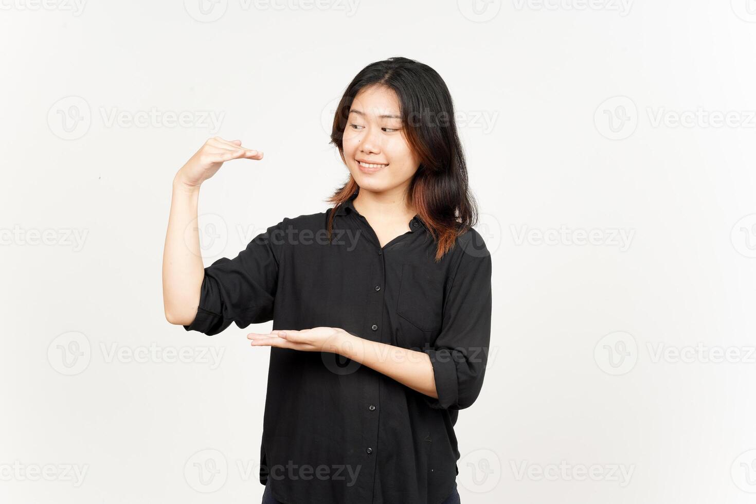 Measuring and Showing Big Sign Product of Beautiful Asian Woman Isolated On White Background photo