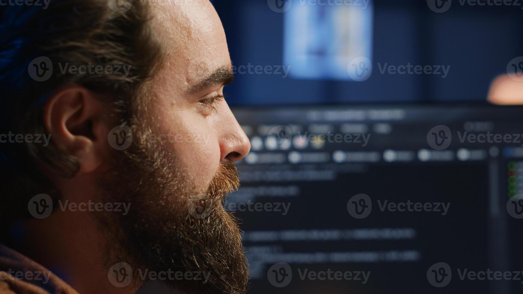 Happy software engineer feeling satisfied after removing all bugs while coding on computer, close up. Joyous IT admin looking at PC screen, pleased after solving script errors, camera A close up photo