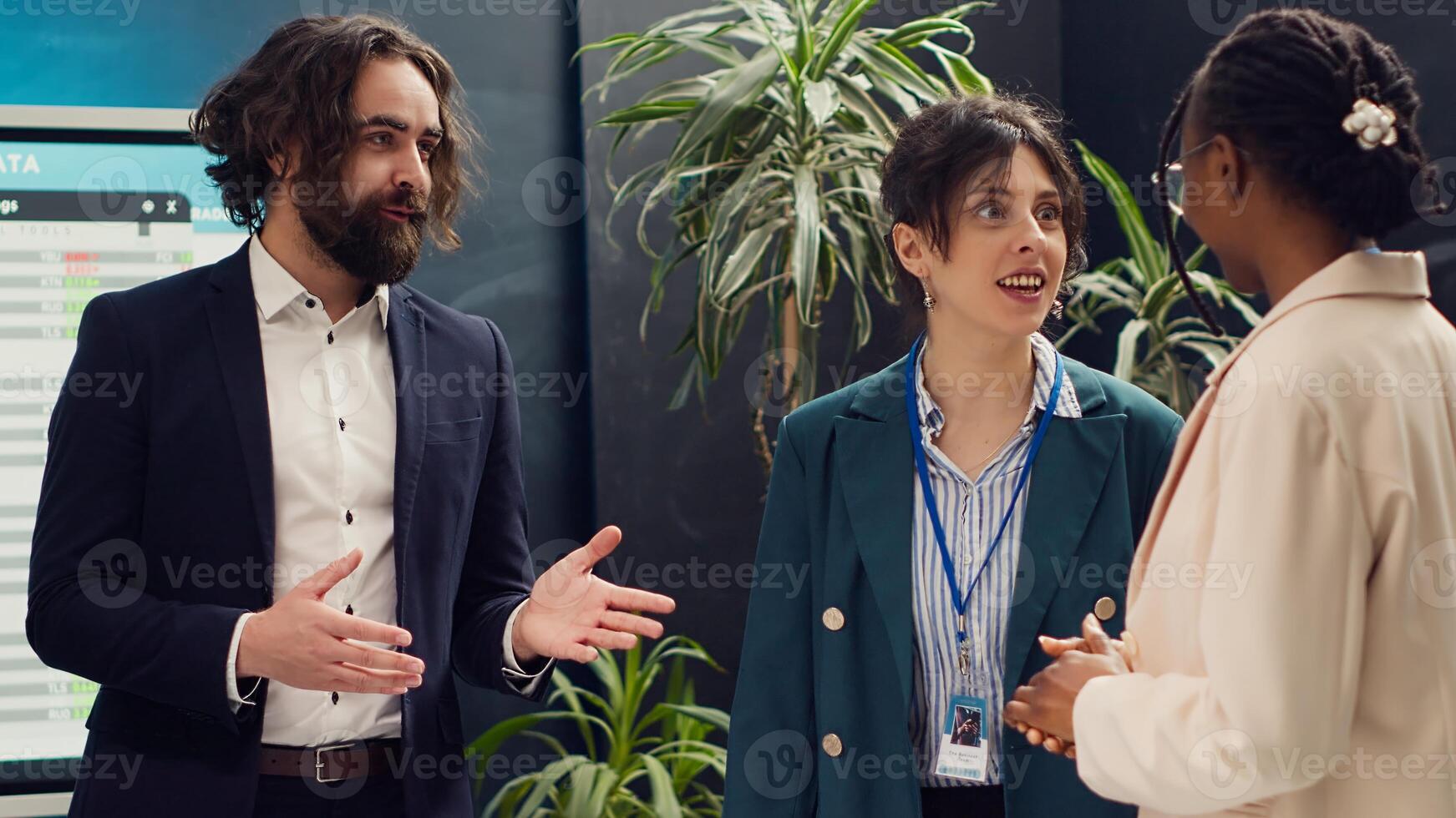 Staff members from a business organization are discussing interest in new projects during a corporate briefing meeting. Team of coworkers stays informed about industry developments. Camera A. photo