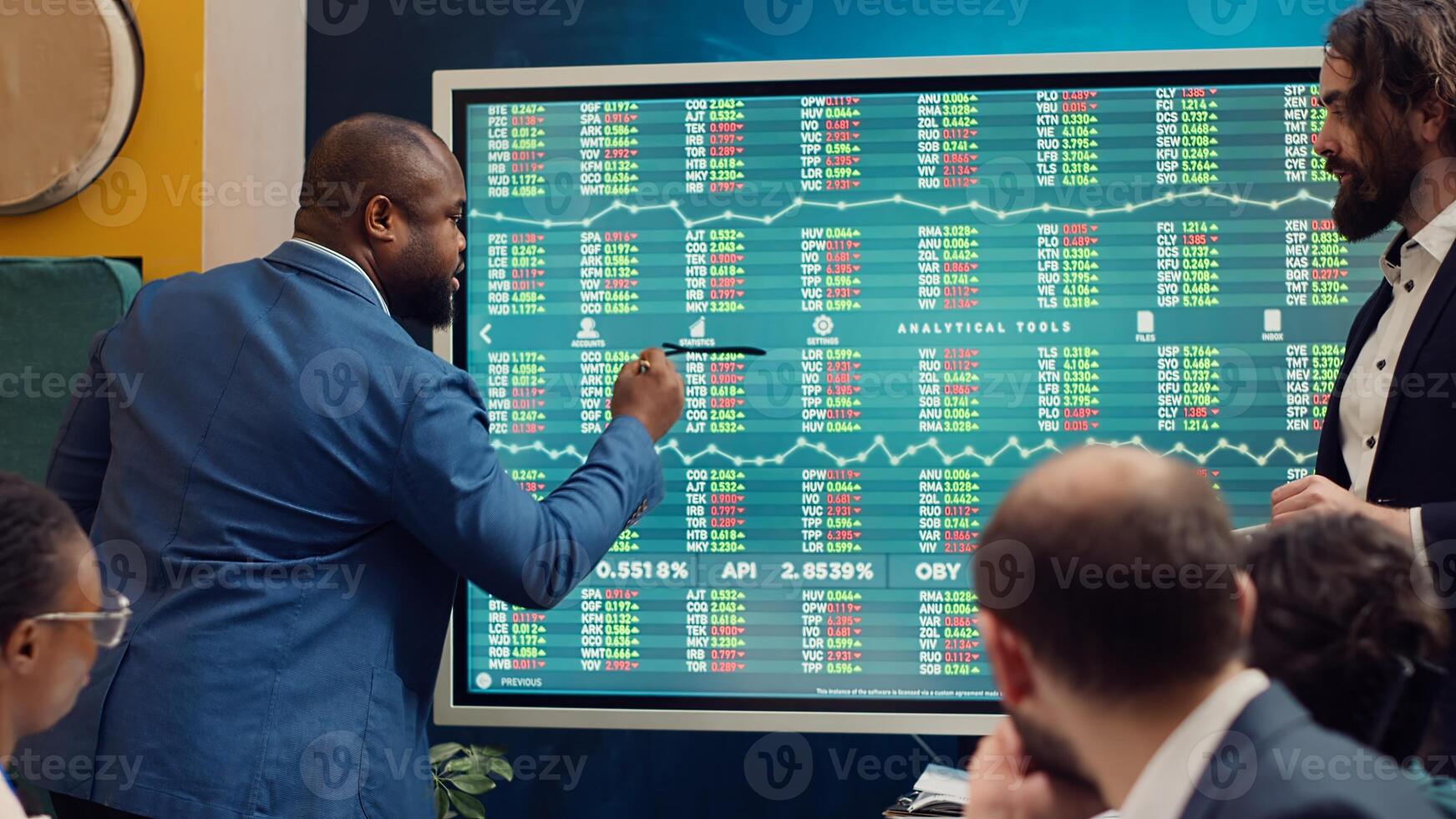 Team of business analysts following stock trade trends on interactive board, developing a new financial strategy to obtain funds. Forecast affiliates working on organizational success. Camera A. photo