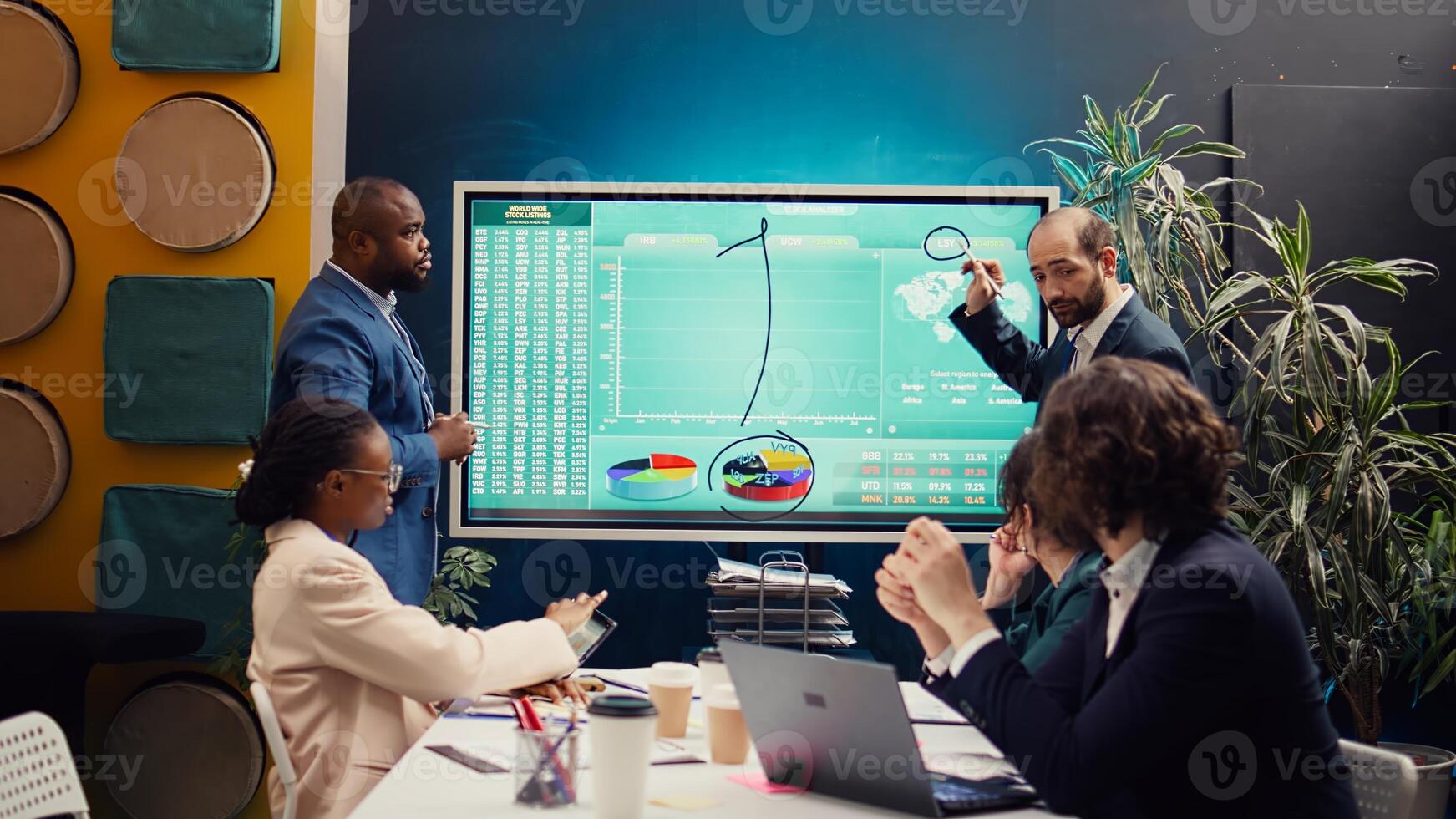 Account executive team analyzing trends to help in making important decisions to corelate with company objectives. Business associates working together to meet project deadline. Camera B. photo