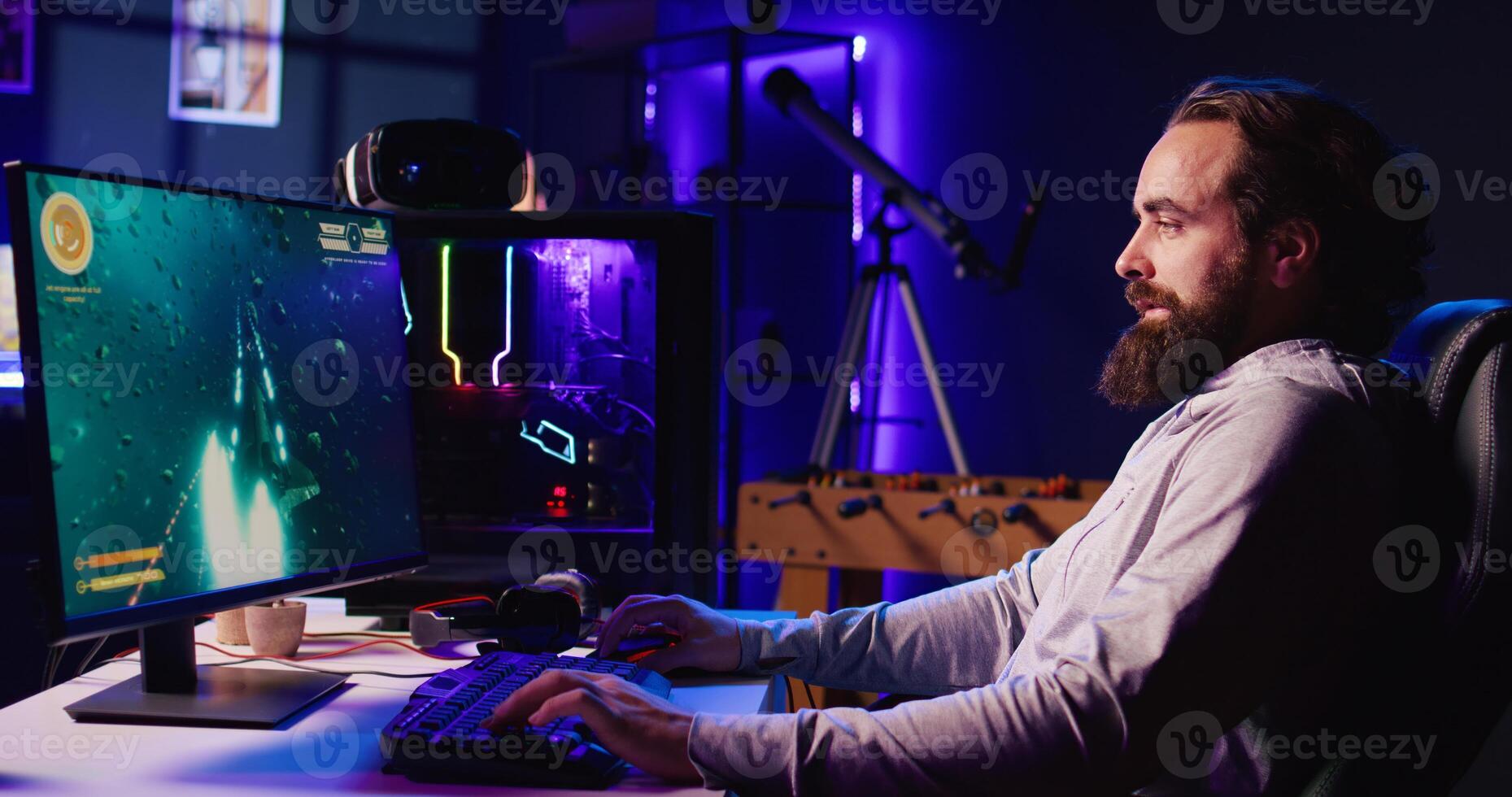 Man using gaming keyboard to fly spaceship in SF videogame. Gamer using powerful PC and computer peripherals to compete in online science fiction multiplayer game competition photo