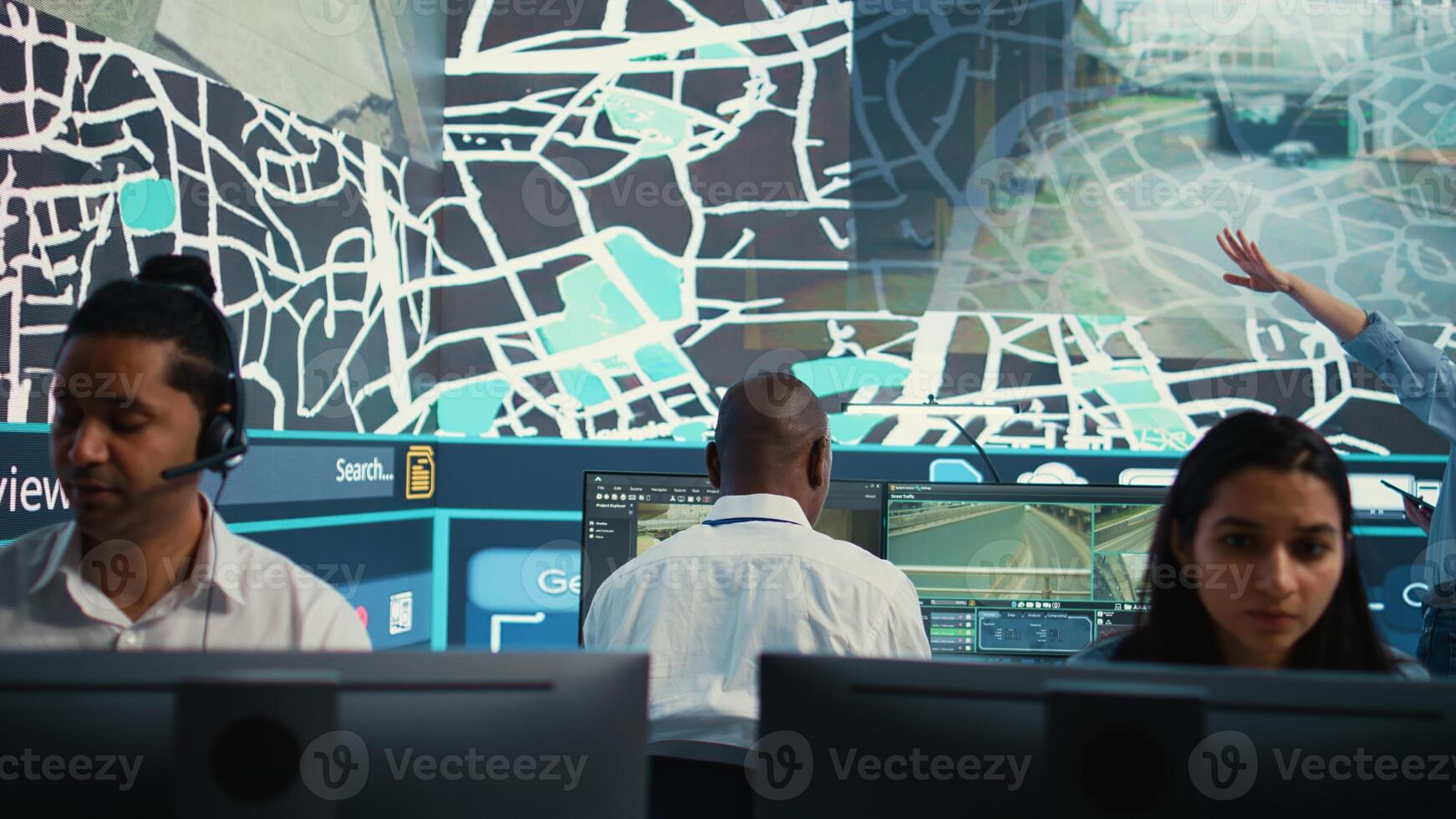 Diverse dispatch operators giving real time updates on order delivery and shipment, working in call center observation room. Employees guiding couriers around the city, CCTV footage. Camera B. photo
