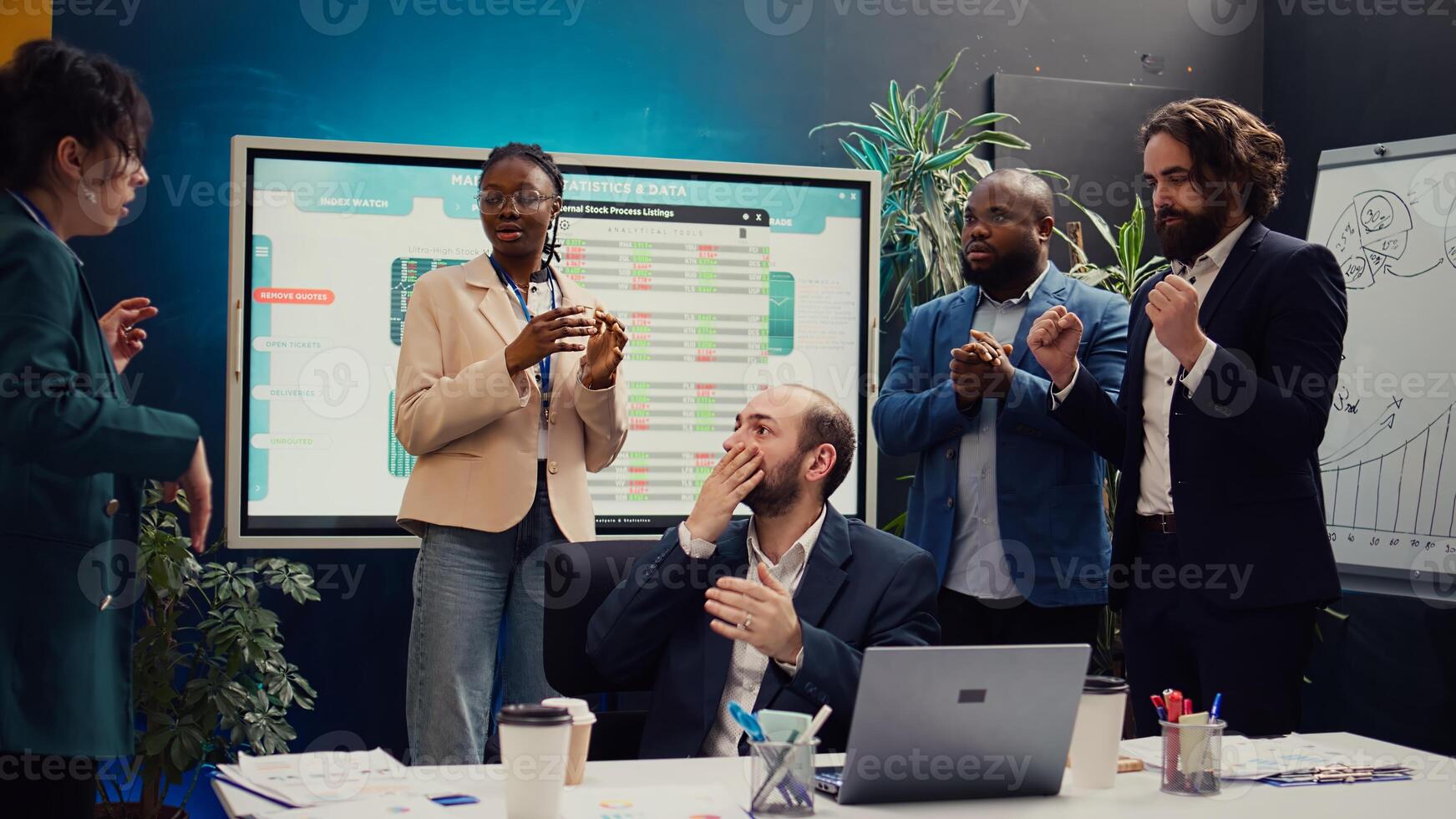 Joyful supervisor accidentally kissing his employee in excitement, being too cheerful and excited about the new team achievement. Irritated woman slapping him after kissing her. Camera B. photo