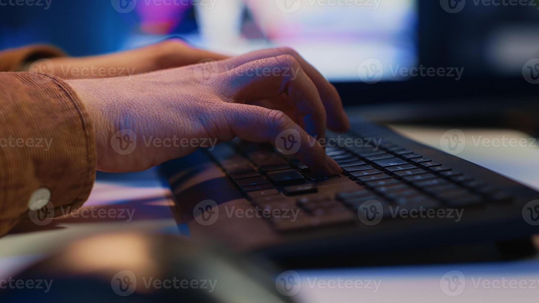 Focus on computer peripheral used by IT admin to type lines of code on desktop PC in apartment. Close up shot of keyboard used by software engineer programming at home, camera A photo