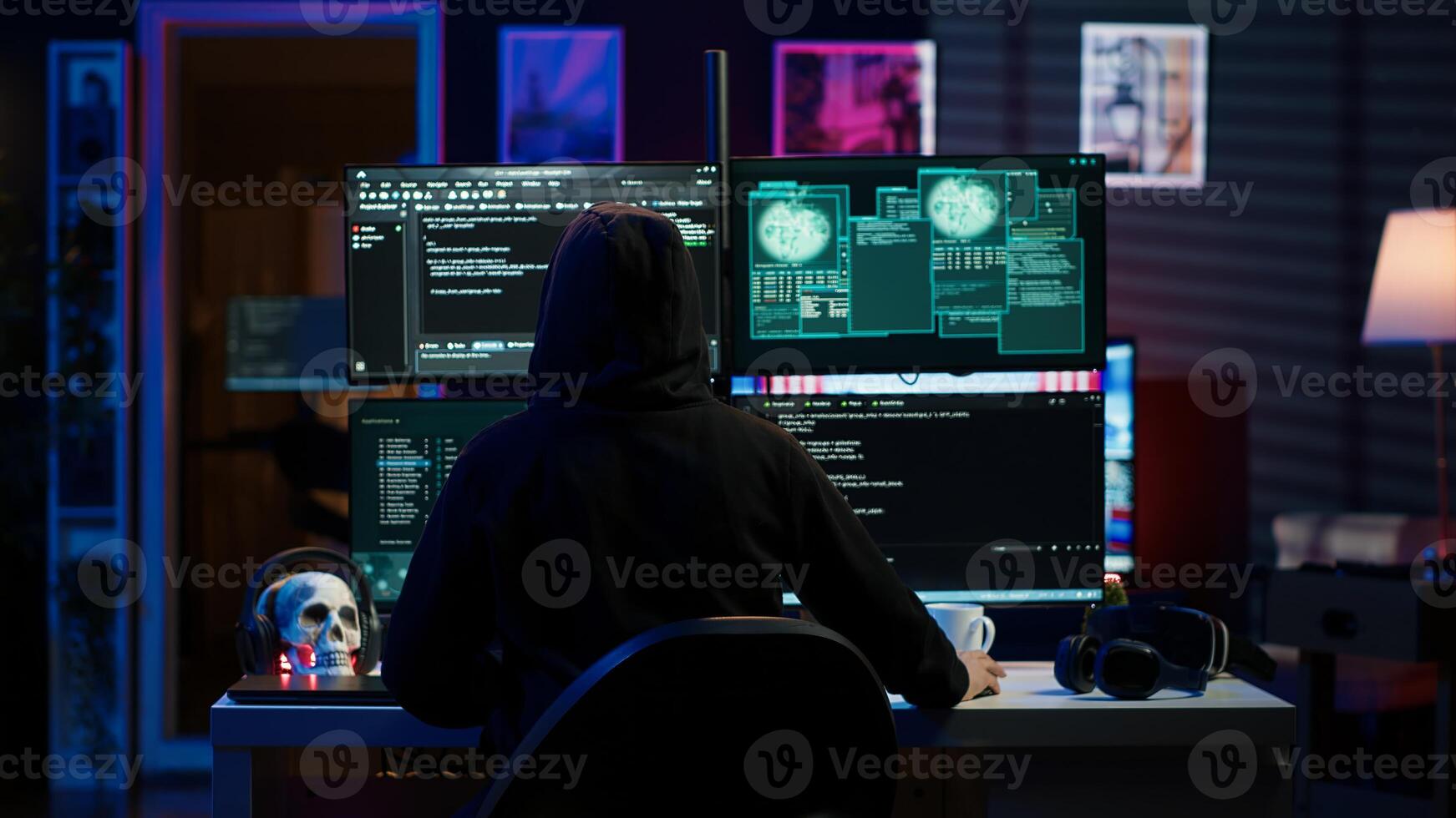 Hacker arriving in underground HQ, ready to start coding malware designed to exploit network backdoors and bypass security measures such as logins and password protections, camera A photo