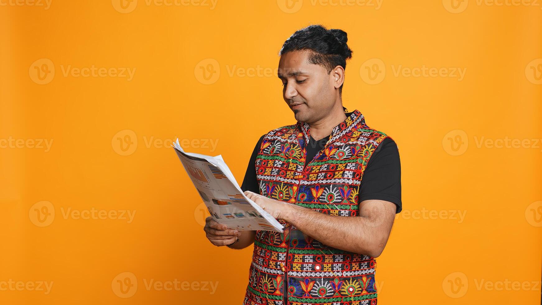 Accountant doing profit analysis for company, browsing files, isolated over studio background. Worker doing financial budgeting and forecasting, looking over paperwork graphs, camera B photo