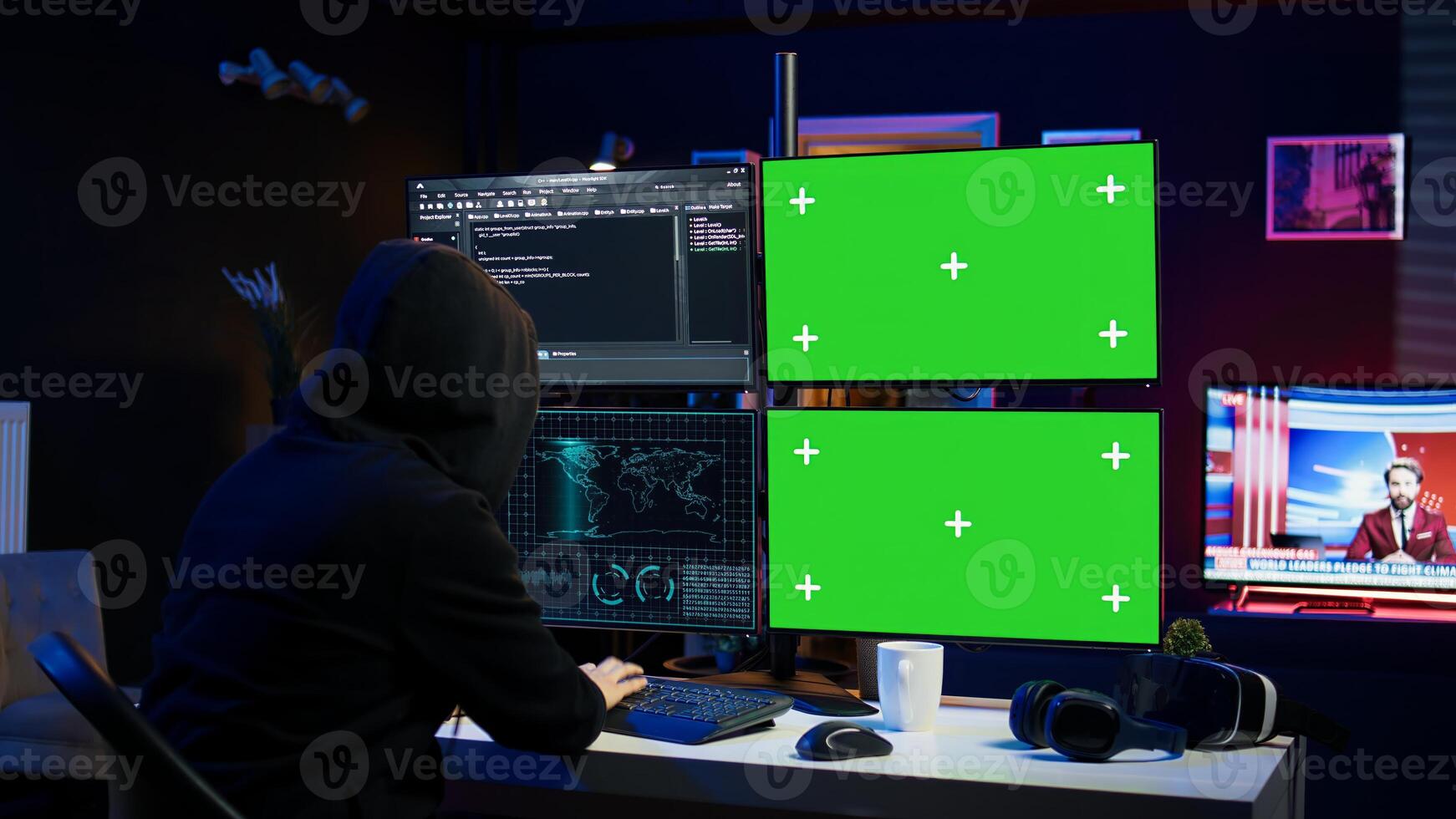 Hooded man writing lines of code on green screen PC from apartment, trying to get past security systems. Evil hacker using mockup computer to make scripts that can hack devices, camera B photo