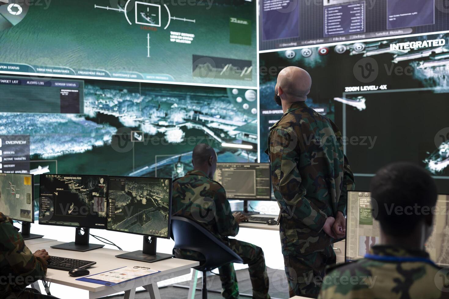 Serviceman in camo uniform overseeing surveillance activity in monitoring room, ensuring operations success. Troopers analyzing radar systems to support military facility missions. photo