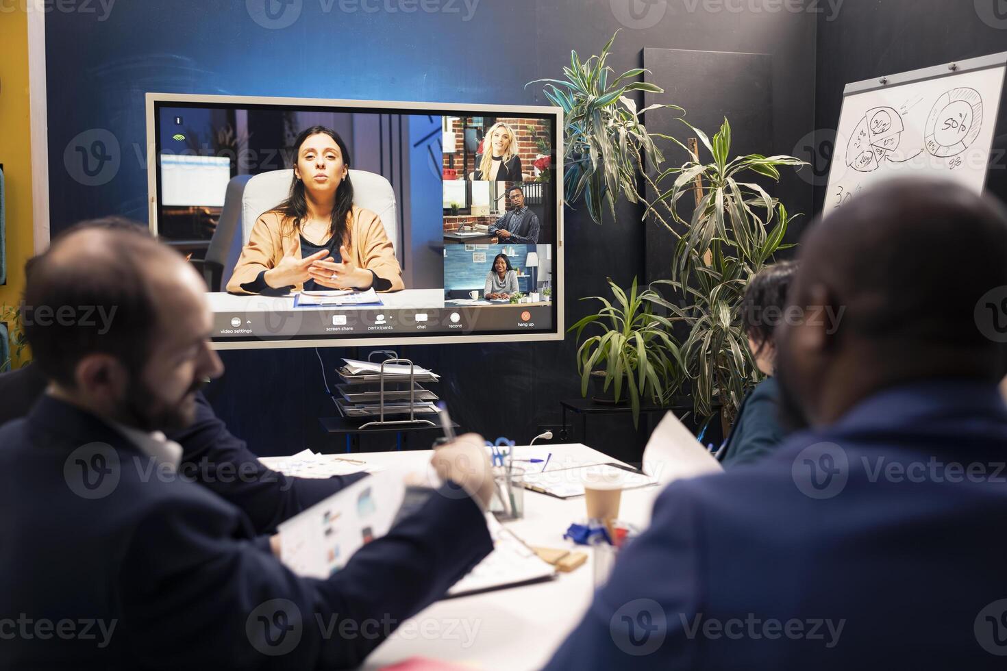 Business associates collaborating on international corporate project via videocall, discussing about different ideas of increasing capital. Partners make strategies to improve organizational culture. photo