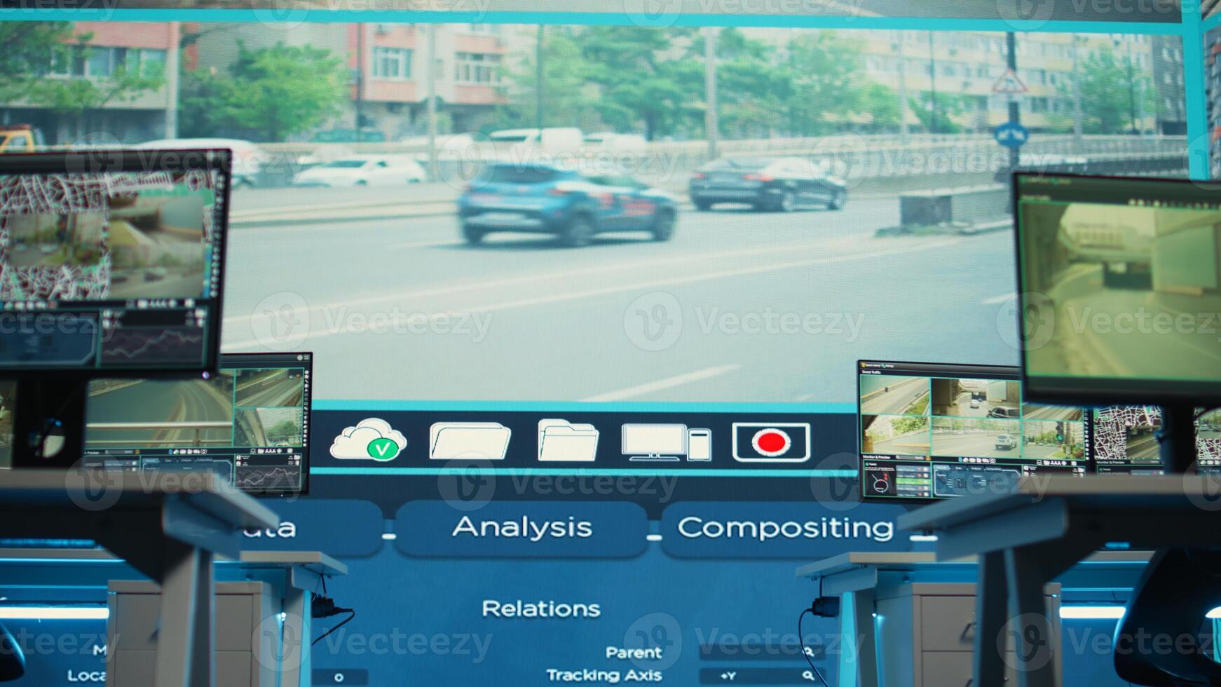 Government agency employing CCTV system in empty monitoring room with traffic surveillance footage. Offices with computers running satellite radars on camera around the city. photo