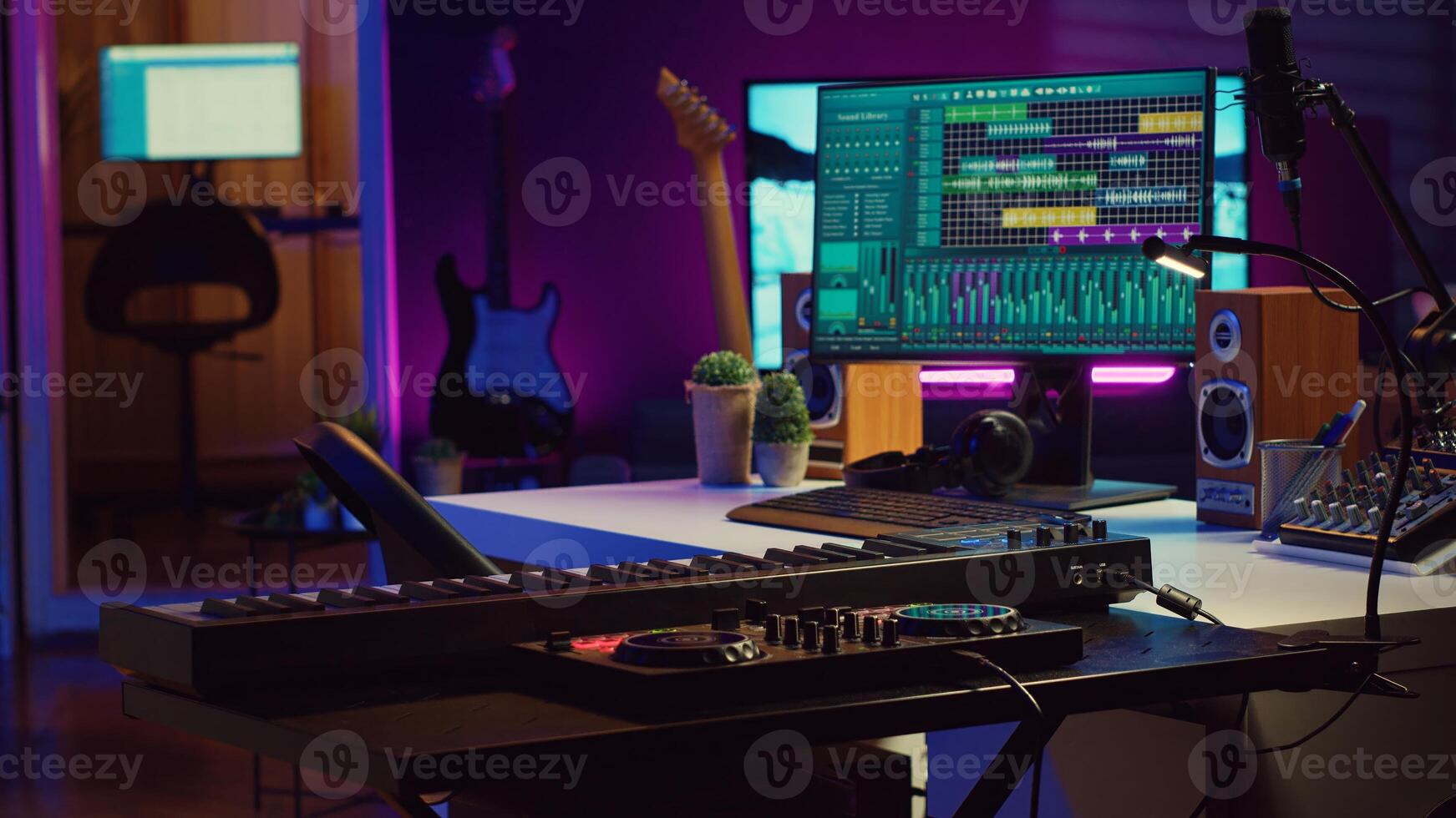 Creative space used at recording songs and tunes with daw software, various electronic equipment and tools for mix and master performance. Empty home studio with mixing panel and amplifier. Camera A. photo