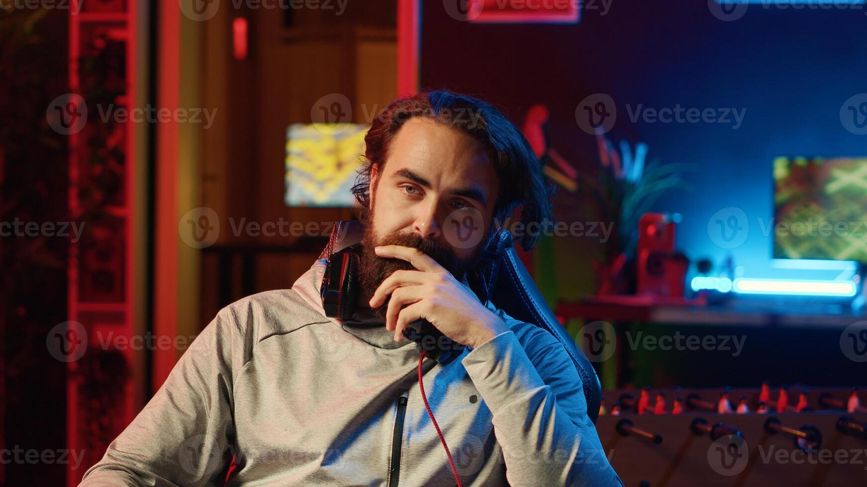 POV of gamer feeling frustrated after losing against opponent in online esports competition. Upset player angrily removing headphones after being defeated by enemy in videogame internet tournament photo