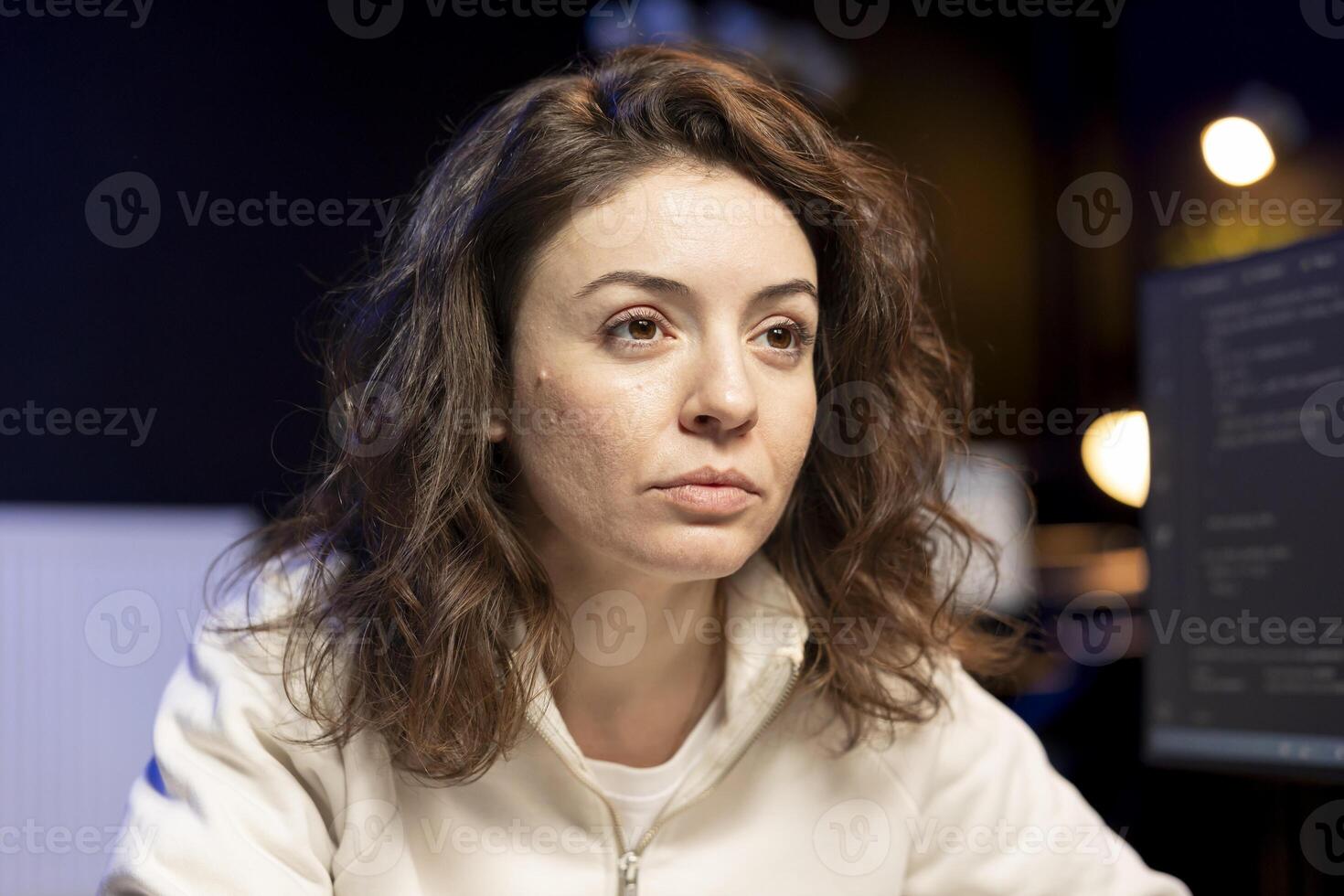 Computer engineer focused on doing software quality assurance, reading source code on screen before implementing it. Technician inspecting coding on desktop PC, looking to fix potential issues photo