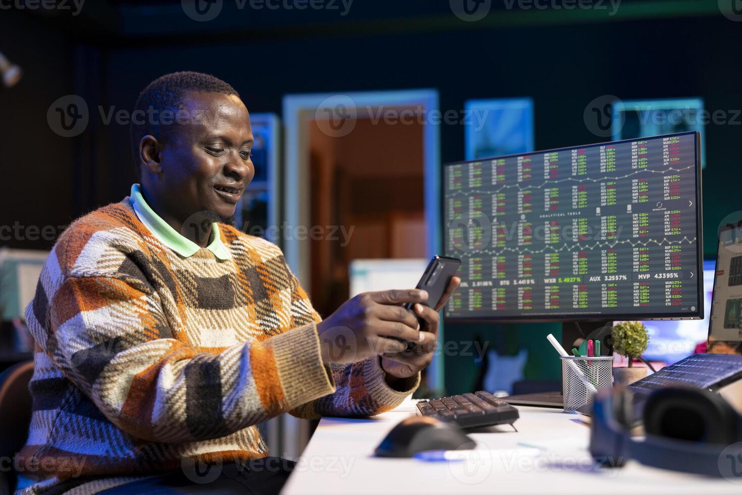 Financial expert takes a break on social media using his mobile phone, creating the capital funds research to help with global investment. Young advisor handling private wealth management. photo