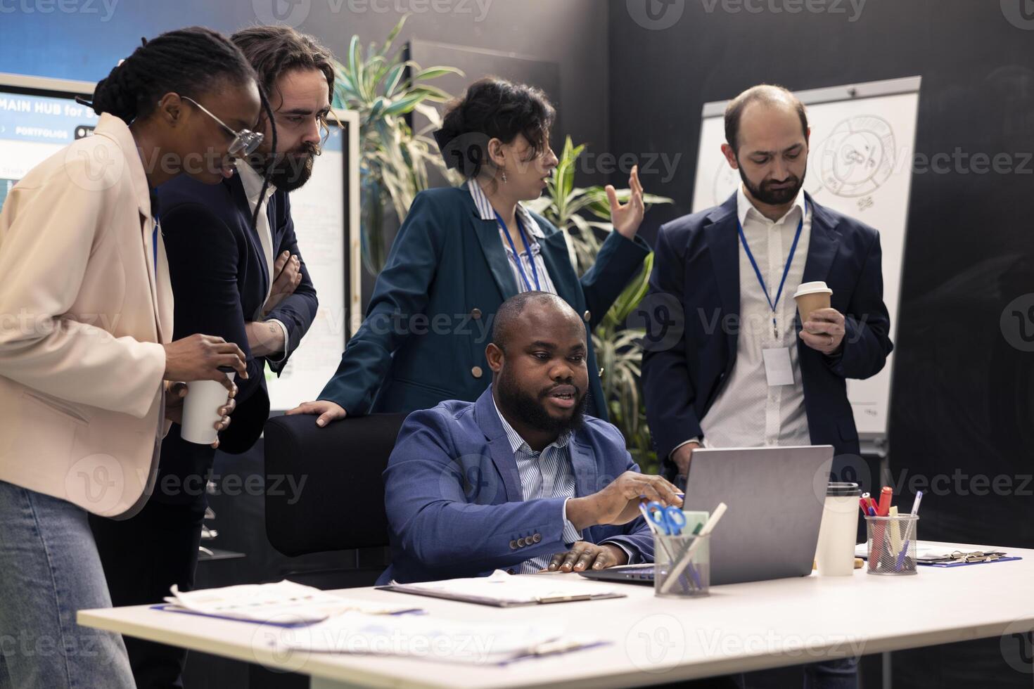 Sales analysts reviewing market trends and statistics in a conference room, meeting to create a new analysis for the new marketing strategy. Workers brainstorm innovative ideas. photo