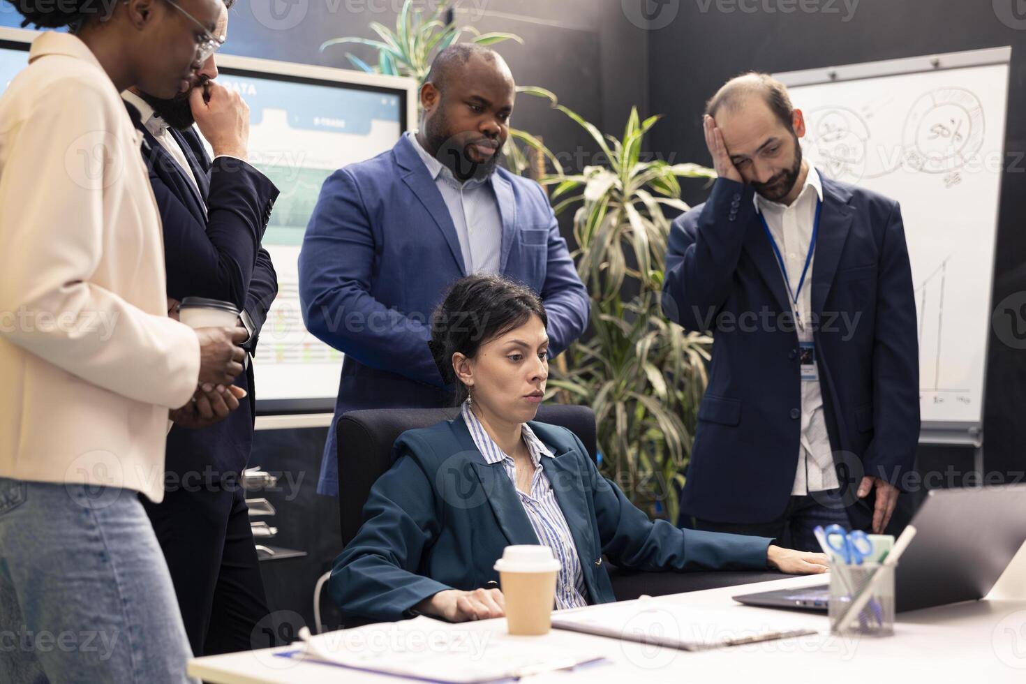 Furious difficult team leader getting frustrated with her staff team after not finishing the project before the deadline. Angry dissatisfied supervisor being displeased and yelling at her team. photo