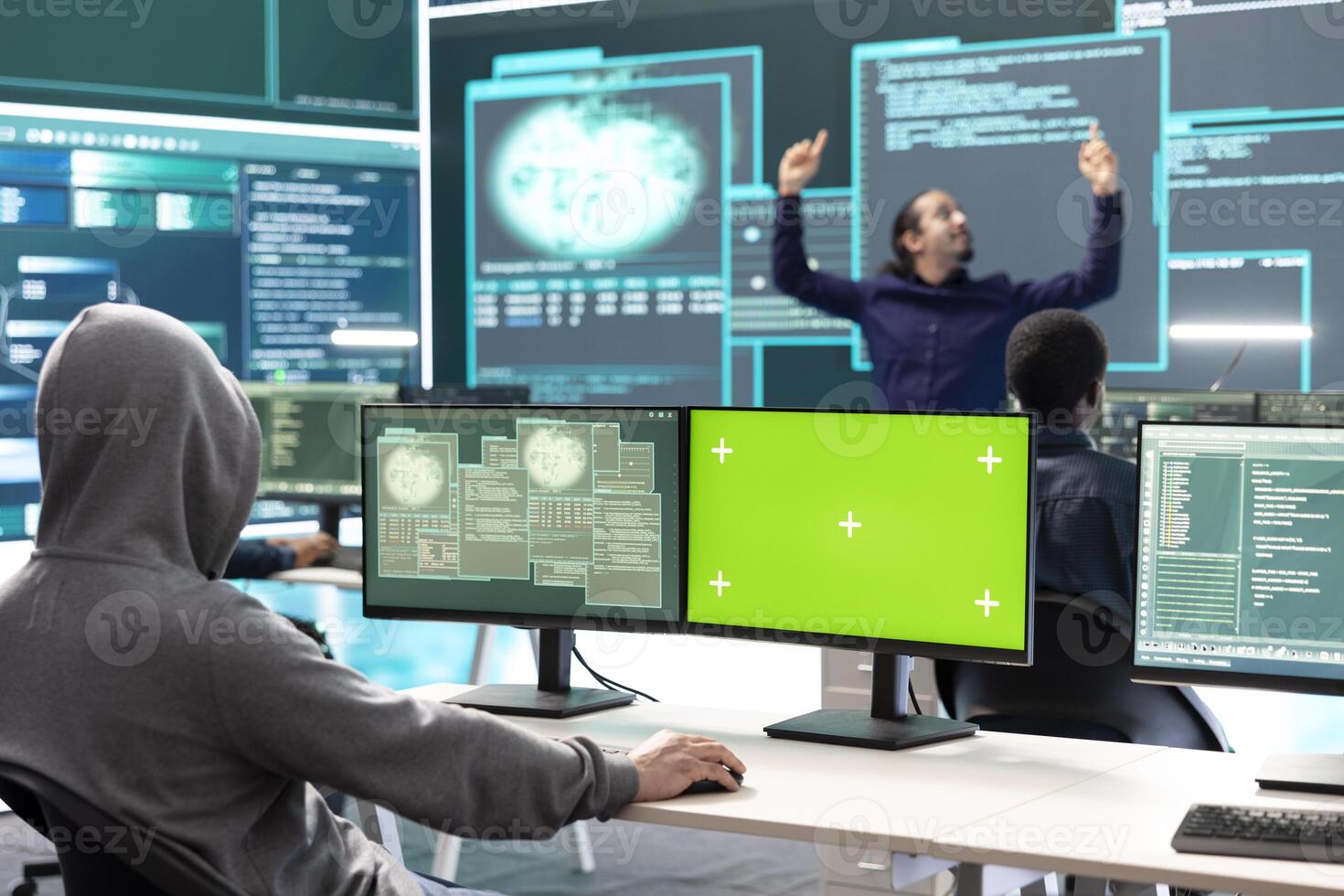 Professional team of governmental hackers conducting cyber surveillance, looks at isolated copy space screen. Expert examines cybersecurity measures and online security in high tech agency. photo