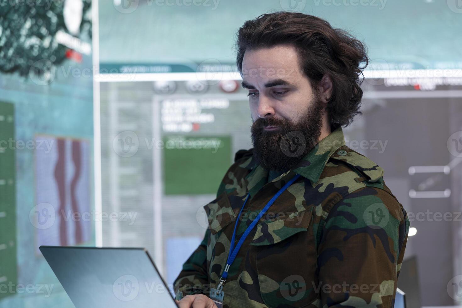 Technical engineer gathers intelligence from world map projection, connected to satellite reconnaissance system to support field troops with real time data. Dispatch army command post. photo