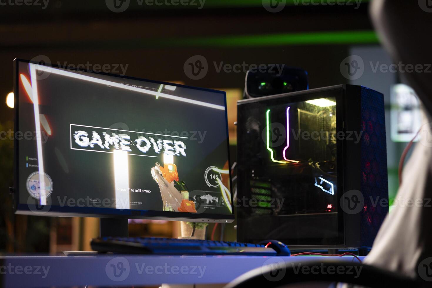 Upset gamer feeling depressed after losing online competitive multiplayer match, playing on gaming setup. Player feeling angry and shouting after being defeated in videogames photo