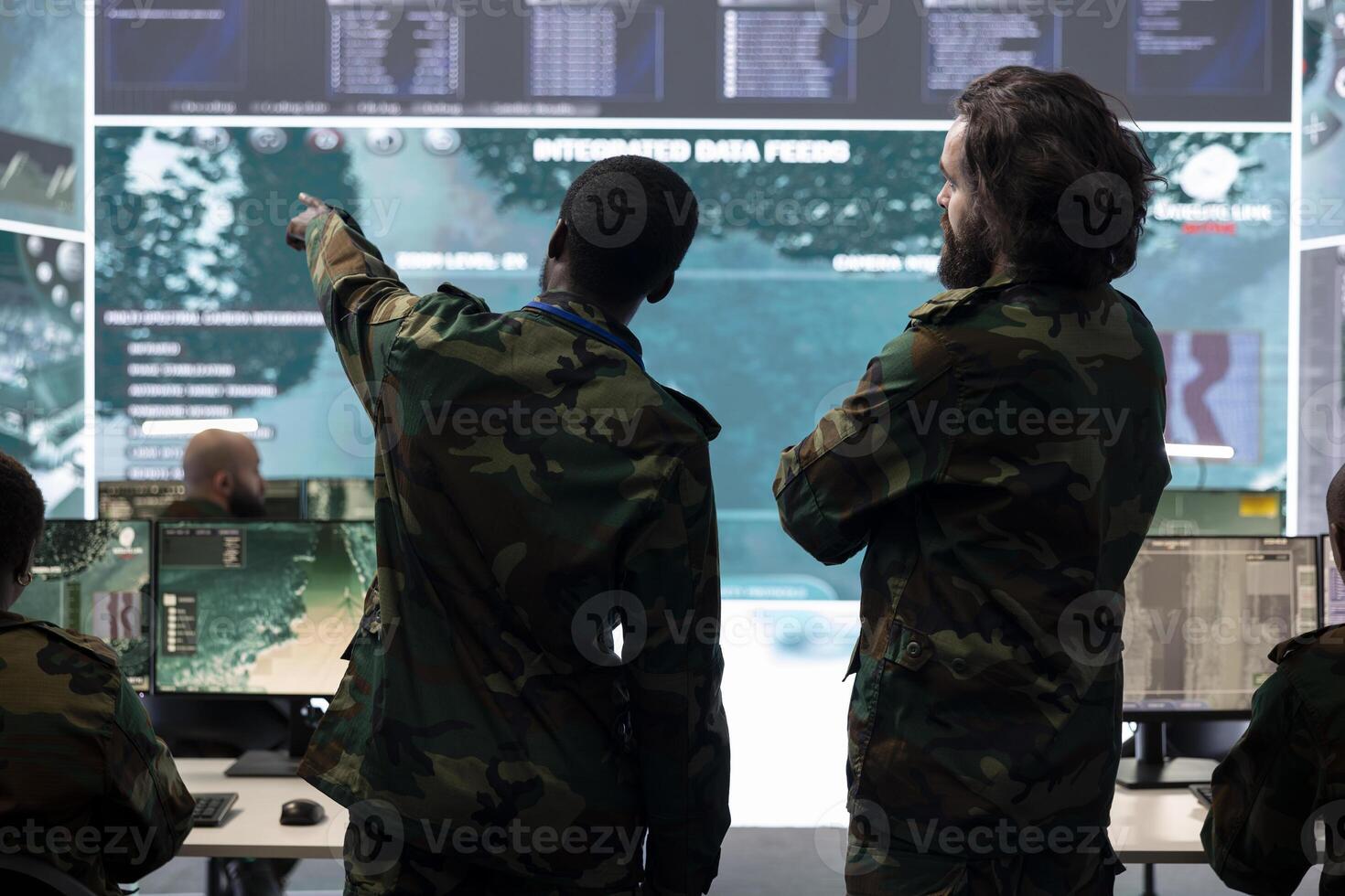 Infantry unit staff talking about enemy vessel gps location in control center, analyzing real time information for national safety mission in command post. Army personnel gathering intelligence. photo