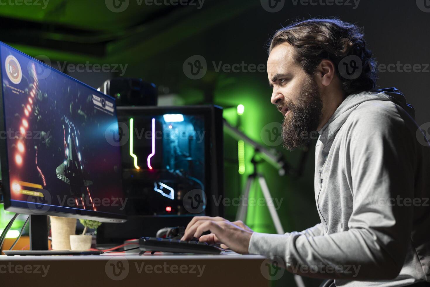 Livid gamer raging in frustration after losing mission while playing spaceship videogame. Mad player furious after getting spacecraft attacked by enemies in game, fearing game over message photo