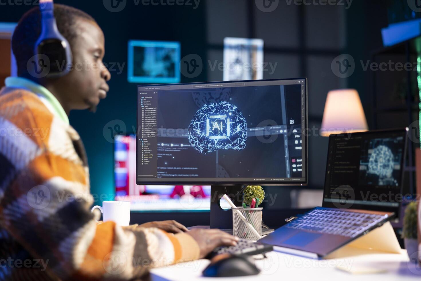 African american man working on computer to write code and programming in artificial intelligence and deep learning. Male IT engineer using pc to ensure cyber security, neural network. photo