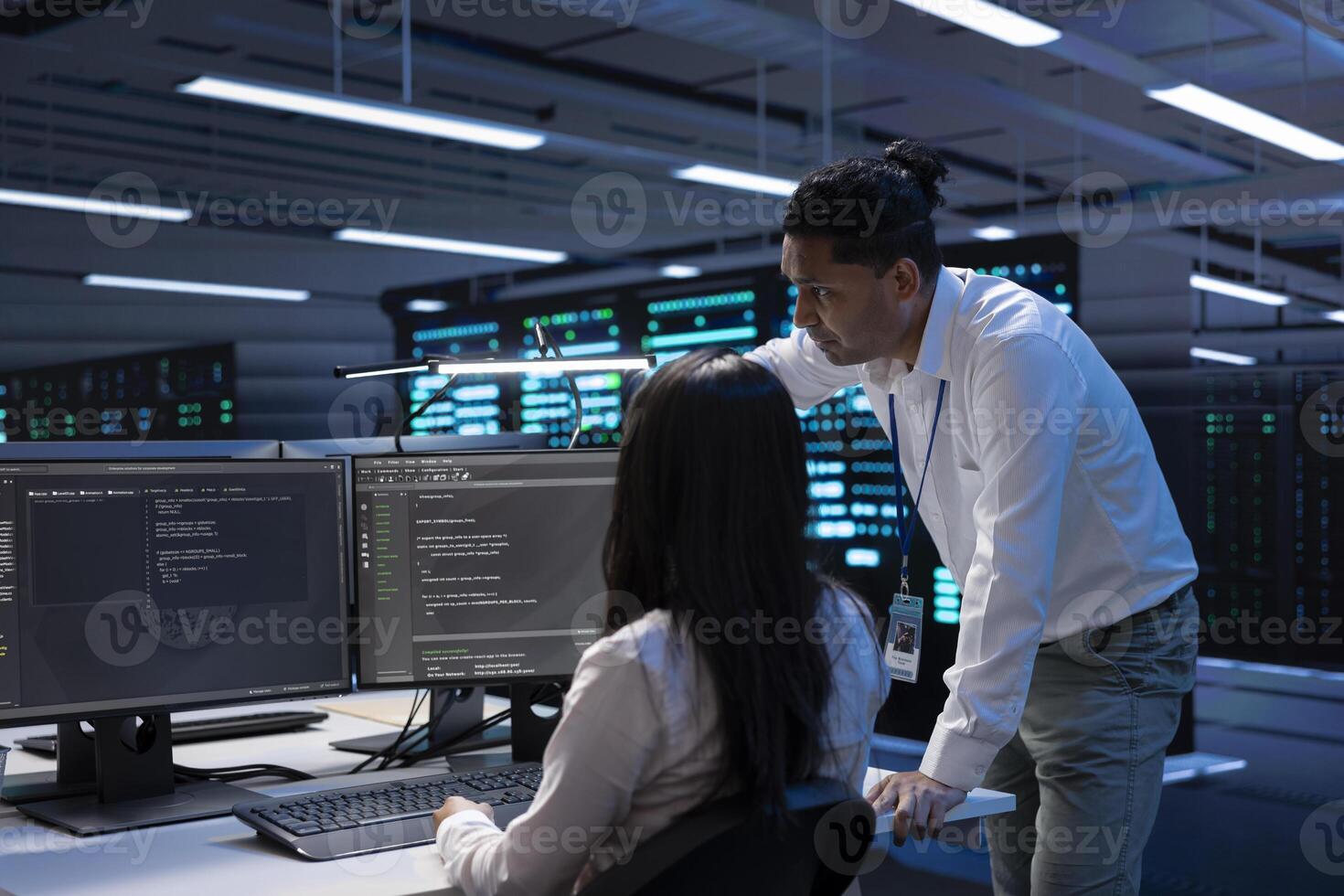 System administrators in data center running system diagnostic tests on PC to fix problems. IT experts deploying and error checking utilities on computers to repair network issues in server rigs photo