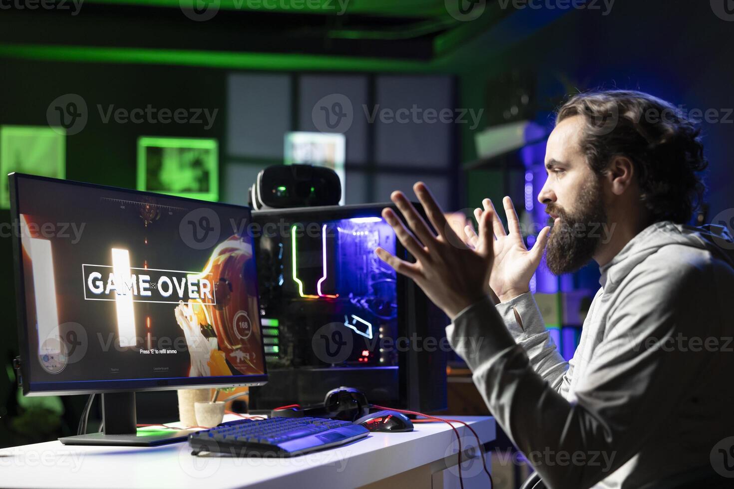 Gamer unable to understand what happened after being defeated by opponents while playing esports tournament. Surprised player feeling shocked after losing while competing in multiplayer videogame photo
