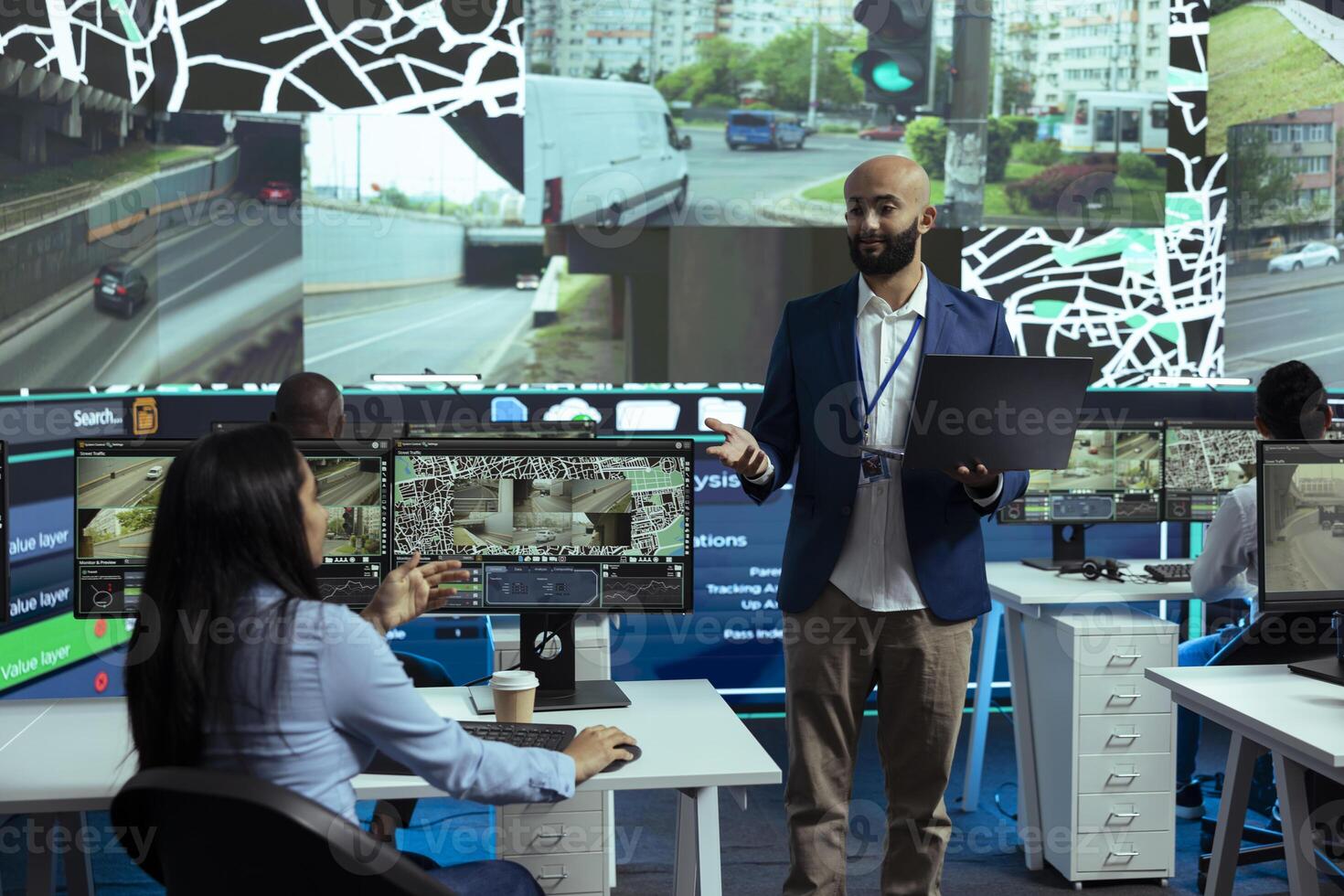 Middle eastern supervisor oversees order tracking activity in control center, ensuring express delivery service by using public surveillance system. Employees guiding the couriers around the city. photo