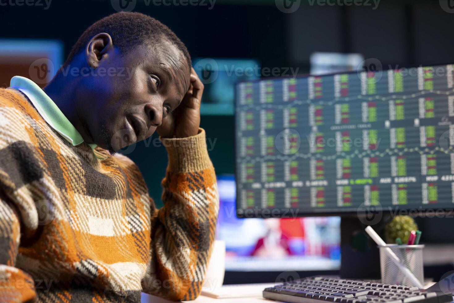 Tired financial advisor works on revenue balance with annual statistics, creating report for CEO under pressure before risking income in investments. Accountant evaluating legal insurance. photo