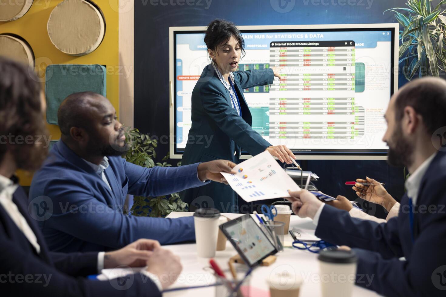 Forecast affiliates meeting in a conference room space to review business news and progress. Employees and office manager training to expand the organization internationally. photo