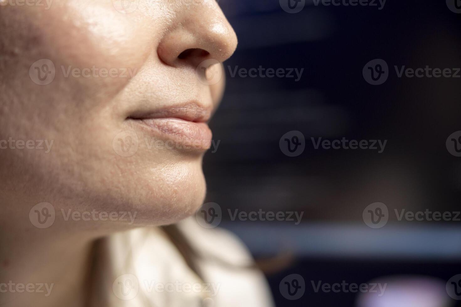 Pleased developer showing happiness after securing company servers from virus attacks. Extreme close up of smiling IT employee feeling positive emotions after succeeding building firewall photo