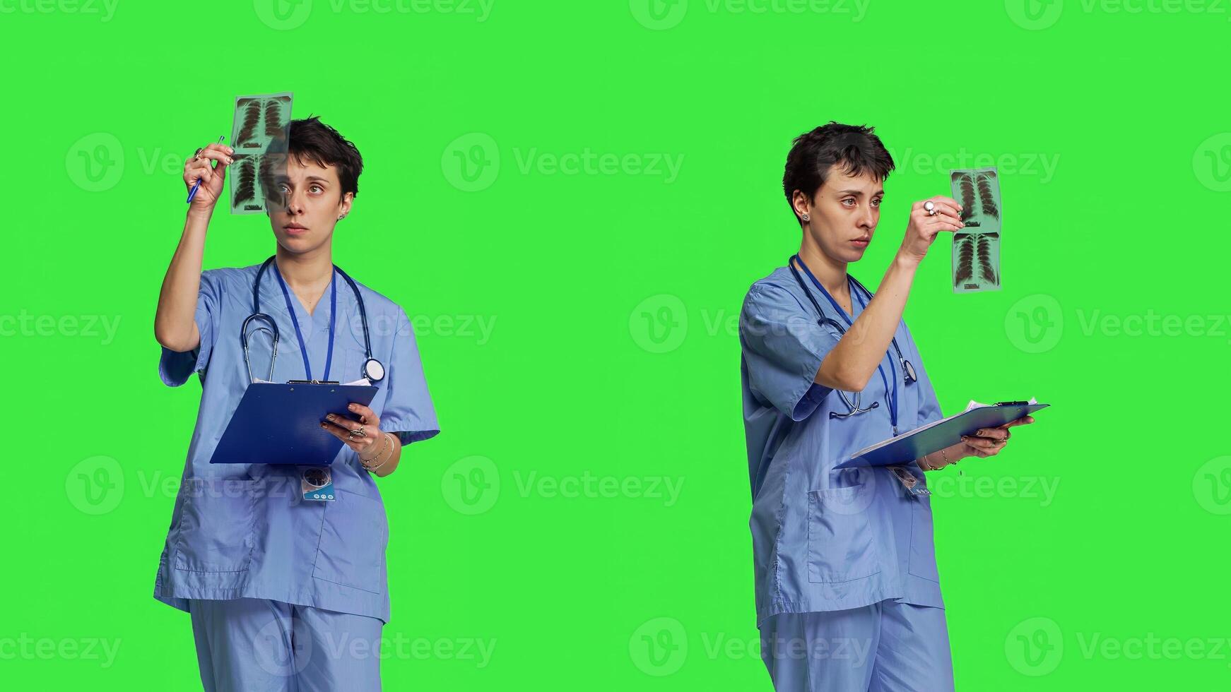 Medical specialist examines x ray scan in hospital laboratory, looking at radiography to determine patient disease diagnosis. Nurse uses radiology expertise against greenscreen backdrop. Camera B. photo