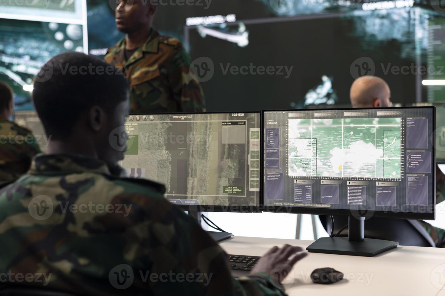 Army IT specialist interprets registered satellite CCTV footage for insight while he is targeting enemy positions. Air force crew officer takes notes about hostile vessels trajectory, reconnaissance. photo