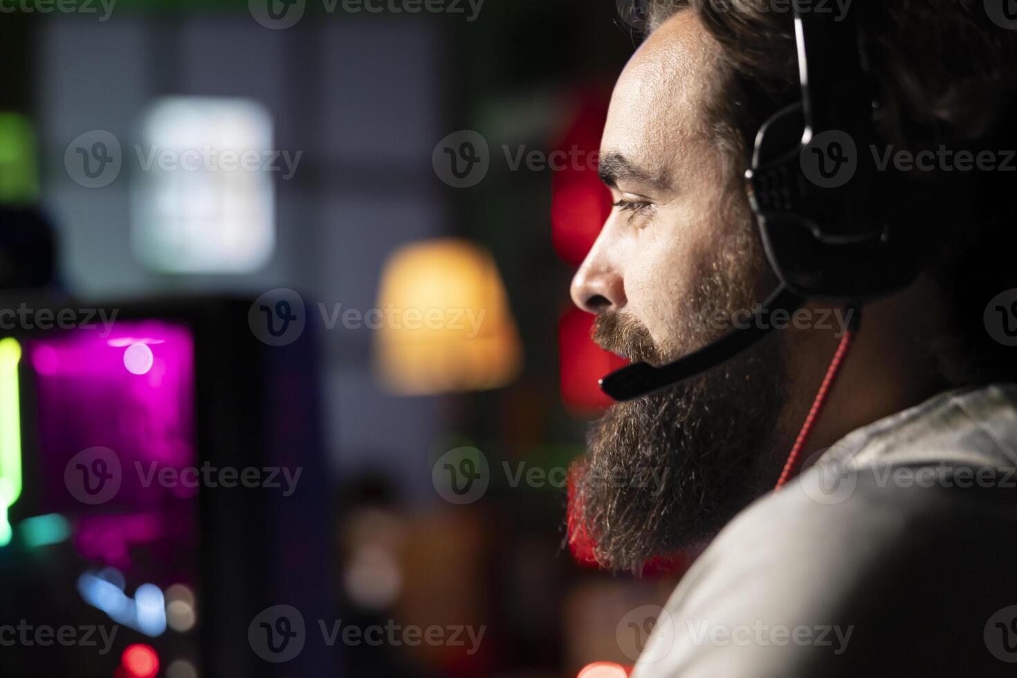 Player plays first person shooter videogame with internet teammates, discussing strategy to defeat flying robots. Close up of gamer talking with friends in competitive PvP fps multiplayer game photo