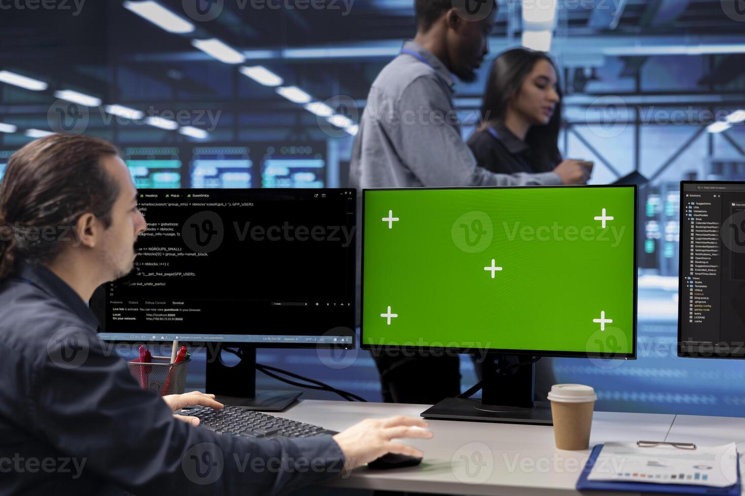 Programmer in data center using green screen computer to check for server performance issues. IT professional in server hub fixing errors slowing down hardware using mockup desktop PC photo