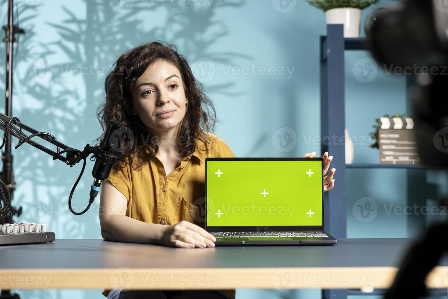 Media star filming technology haul, doing unboxing of chroma key laptop. Tech expert unpacking green screen notebook, recording review for online channel, entertaining fans photo