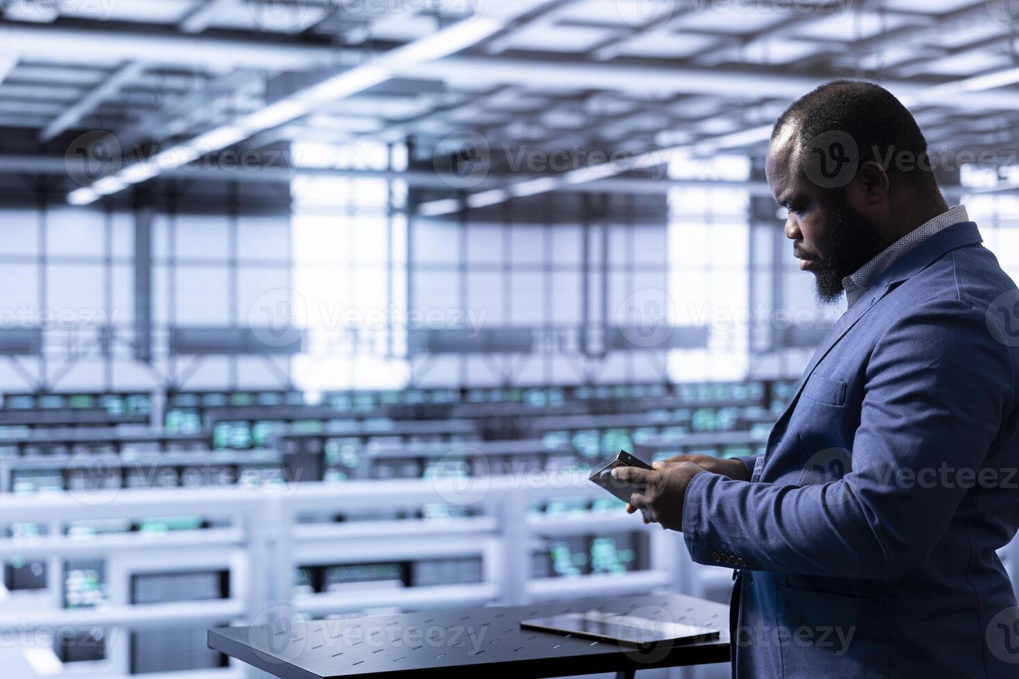Admin in data center checking storage units and infrastructure components, doing maintenance. Employee looking closely at hard drive, planning and executing server hub migrations and upgrades photo