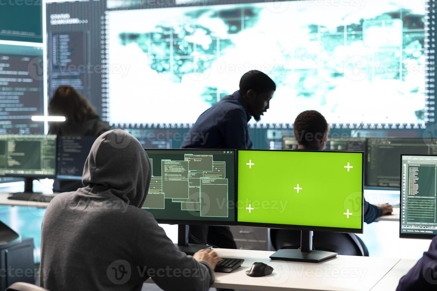 Governmental hackers using green screen in performing cyber security monitoring and threat detection. Examining network security and protection against cyber attacks, national intelligence. photo