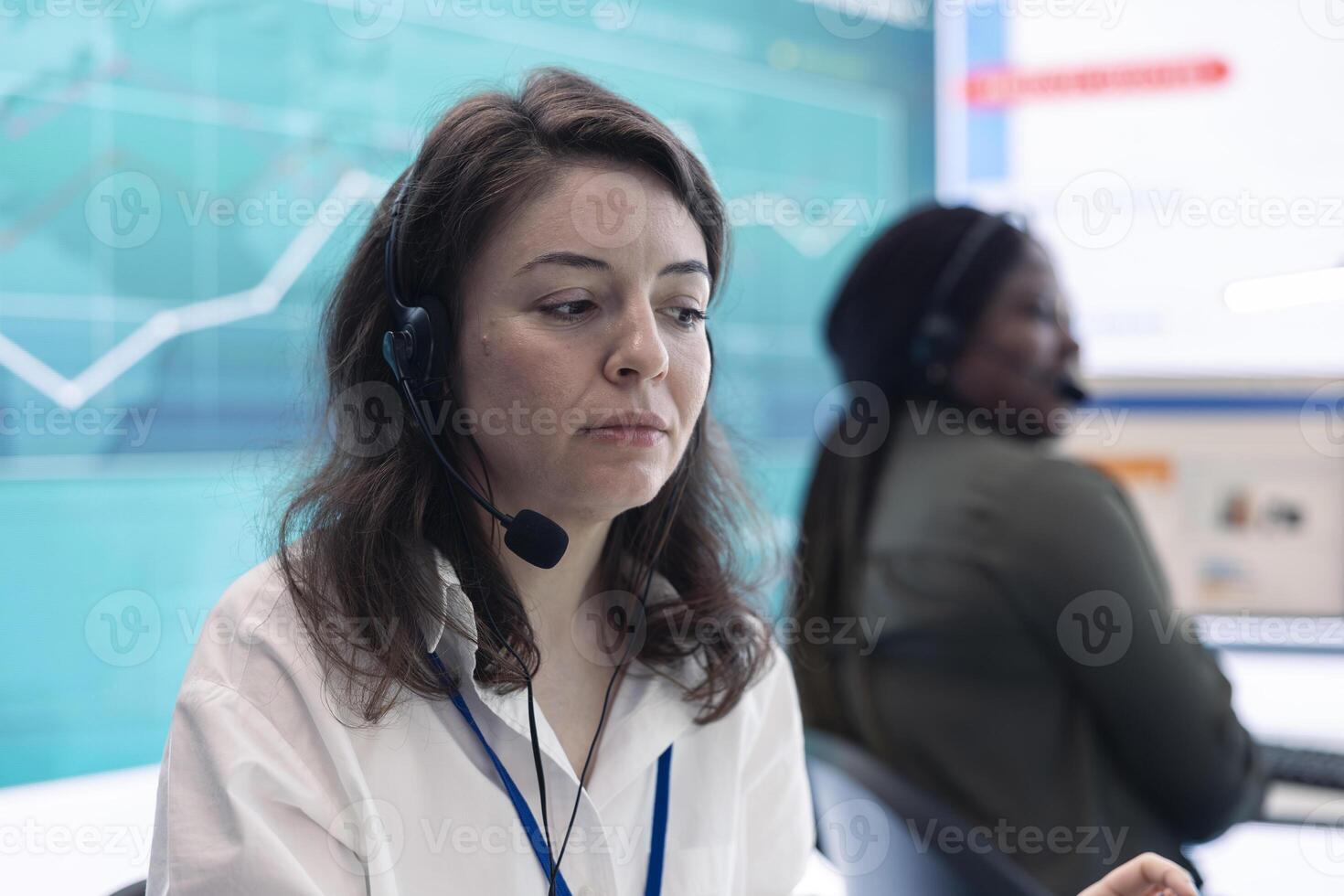 Business assistant calculating budget and costs to review the profit, working with big data in a organizational office space. Professional analyst examines finance infographics. photo